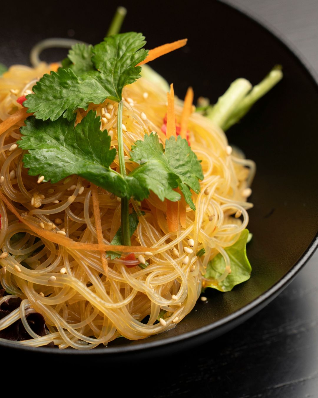 Noodles tossed with coriander and chilli