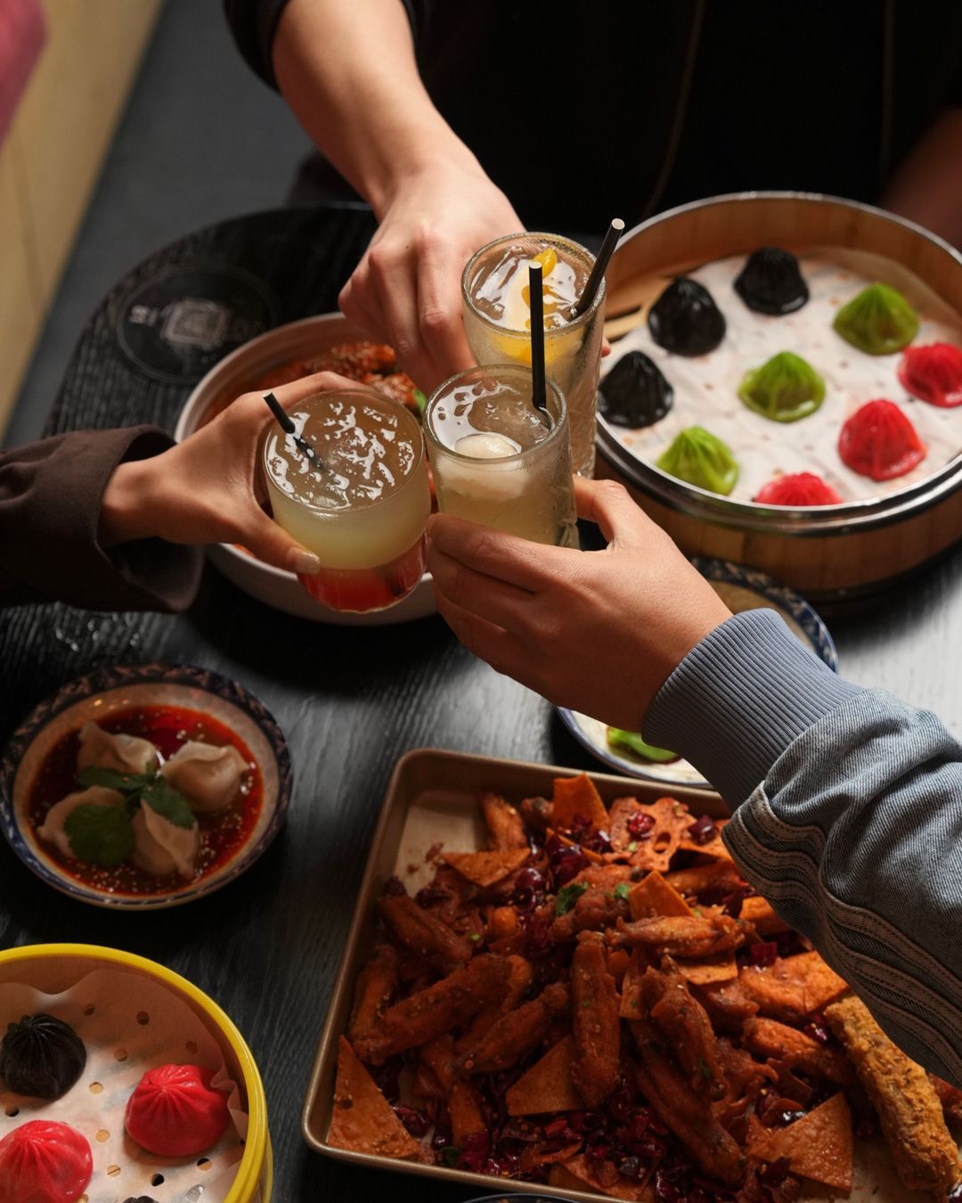 Cheers over xiao long bao
